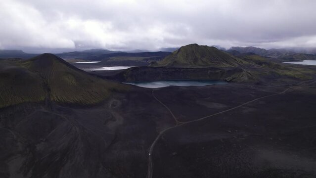 DRONE AERIAL FOOTAGE: Blahylur lake, spelled Bl&aacute;hylur in Icelandic and also known as Hnausapollur, is a stunning crater lake located near Landmannalaugar in the Southern Highlands, Iceland.