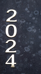 The numbers laid out in the number 2024, on a gray background