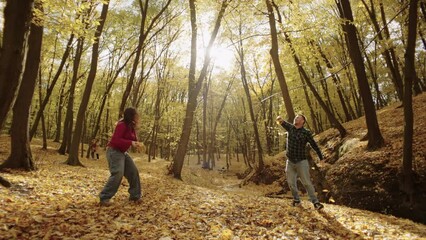 Embracing the Autumn: A Radiant Couple Showered in Golden Leaves, Cherishing Moments of Love. High quality 4k footage