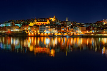 Fototapeta na wymiar Porto, Portugal old city skyline from across the Douro River at night.