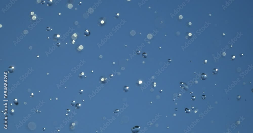 Wall mural slow motion macro of floating micro particles molecules in liquid are analyzed with microscope by ch
