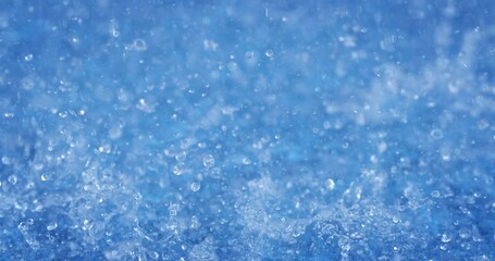 Super slow motion of water surface on light blue background. Filmed on high speed cinema camera at 1000 fps.