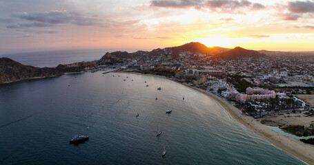 Cabo Beachfront at Sunrise Yachts Under a Red Sky Panorama
