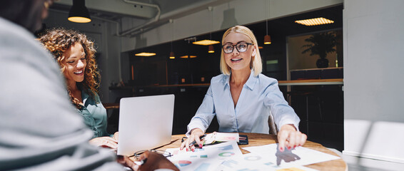 Businesswoman meeting with coworkers