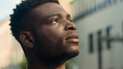 Moving shot close up inspired contemplating biracial guy pensive thinking man looking around on...