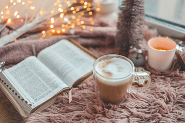 Cup of coffee and open Bible, winter morning mood
