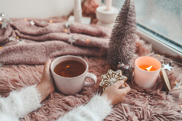 Cup of tea with steam in winter morning atmosphere
