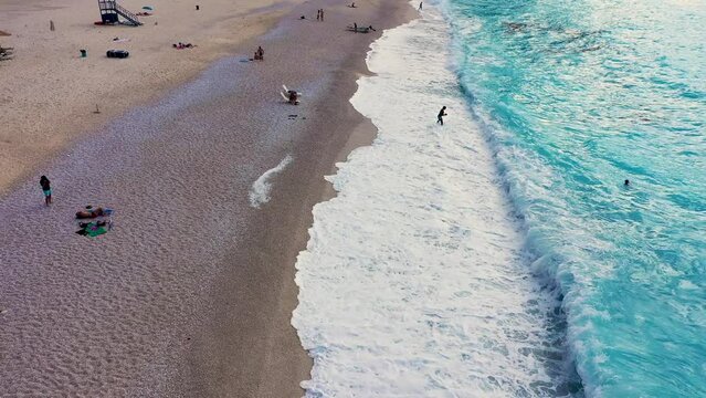 Aerial drone video of iconic turquoise and sapphire bay and beach of Myrtos, Kefalonia (Cephalonia) island, Ionian, Greece. Myrtos beach, Kefalonia island, Greece. Beautiful view of Myrtos beach.