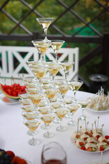 cascade of glasses of champagne at a banquet