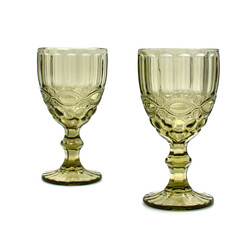 Two empty vintage glasses for wine and champagne on a white background. 