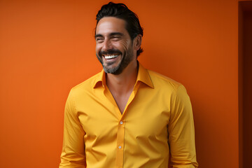 Obraz premium Happy young and smiling man with copy space. Well dressed against solid background.