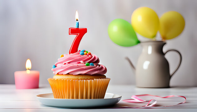 Birthday cupcake with lit birthday candle Number seven for seven years or seventh anniversary