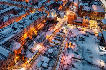 Beautifully lit Christmas fair in the Main City of Gdansk at dawn. Poland