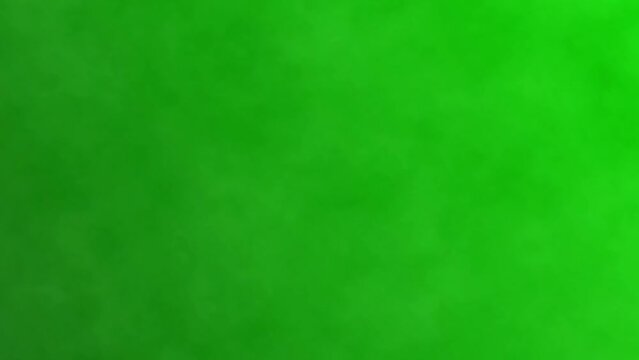 Black smoke on a green screen background, chroma key. Realistic dark smoke cloud, best for using in composition