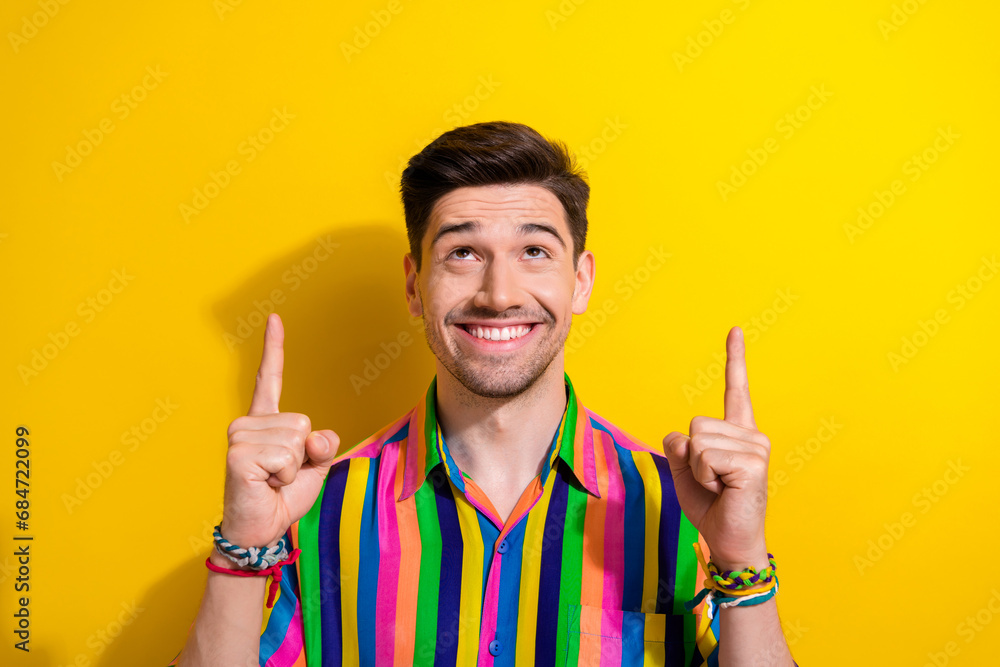 Sticker photo of cheerful businessman in vintage shirt point fingers up look above head great idea for start