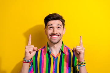 Photo of cheerful businessman in vintage shirt point fingers up look above head great idea for...