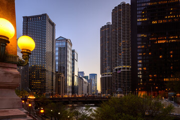 High rise architecture along Chicago river at sunset