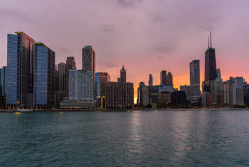 View of Chicago skyline under overcast sky at sunset