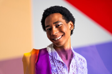 Fashionable homosexual man posing in studio - Fluid gender non binary hispanic  man posing in...