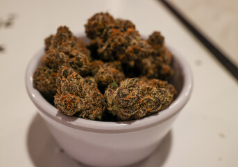 close up of dried marijuana flower in a bowl