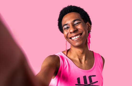 Fashionable homosexual man posing in studio - Fluid gender non binary hispanic  man posing in studio with fashionable clothing - concepts about LGBTQ, genderless and diversity