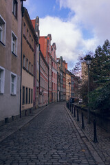 Fototapeta na wymiar Colourful house row street in Wroclaw, Poland . Hidden gem in Wroclaw.