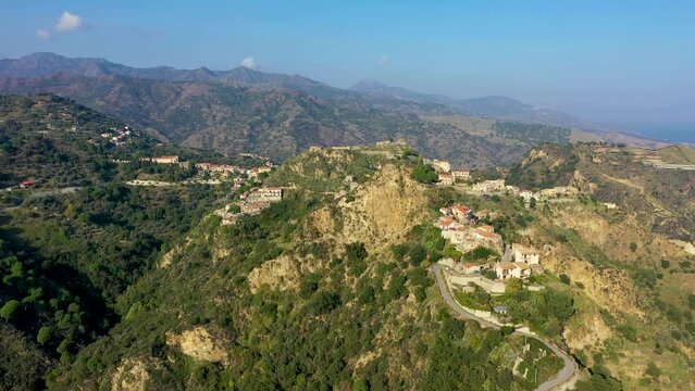 Aerial view of Savoca village in Sicily, Italy. Sicilian village Savoca (known from the Godfather movies). Houses on a hill in Savoca, small town on Sicily in Italy.