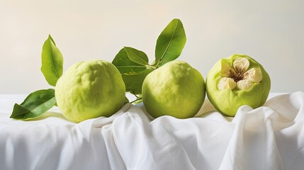 A trio of guavas, fresh and ripe, is elegantly showcased on a stark white canvas, capturing the simple elegance of tropical luxury.