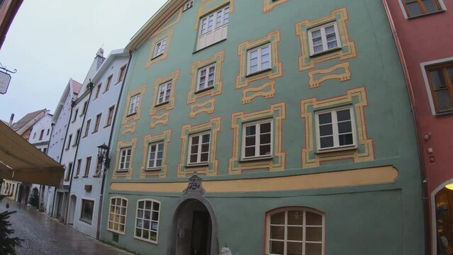 Fussen, Germany, December 5, 2022: DOLLY SHOT- View of the historic medieval F&uuml;ssen old town with colorful houses. Germany Bavaria Romantic Road.
