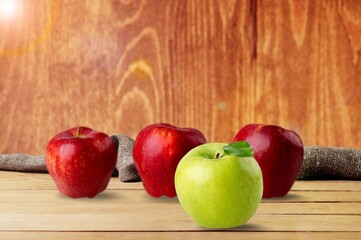 Set of fresh ripe red apples on the desk