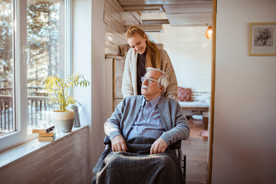 Elderly Man with Caregiver at Home