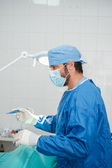 Surgeon preparing an operation with appropriate hygienic measures. Concept: surgery, health care