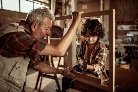 Multi generational family in the woodworking workshop