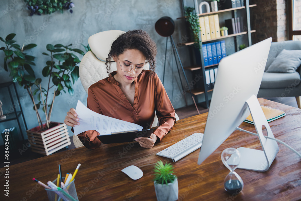 Poster portrait of clever company accountant lady sitting chair read clipboard documents desk loft office i