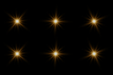 Set of highlights. Flashes of rays of light. The effect of glow, radiance, shine. Collection of various glowing sparks, stars. On a black background.
