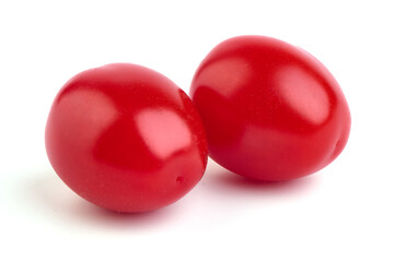 Heap of fresh cherry tomatoes, isolated on white background.
