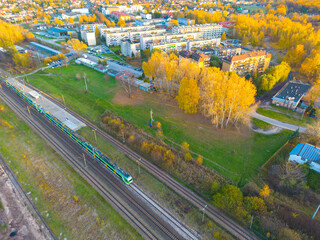 Aerial view of freight train wagons on large railway track field. Concept of modern logistics. Coal...