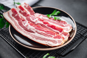 bacon slice fresh meat strips pork cooking appetizer meal food snack on the table copy space food background rustic top view