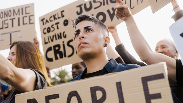 Protest against economic crisis and inflation on the streets. Anti-bank crowd marching for financial recession