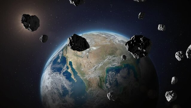 Asteroids flying to planet Earth. Asteroids or meteorites heading for Earth planet, outer space view. End of the world concept. 4k video. Elements of this video furnished by NASA.