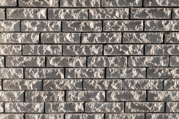 Background photo texture of gray rough brick wall