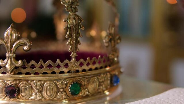 Church attributes for wedding ceremony. Gold crowns are on the altar. Attributes of priest. Interior of church