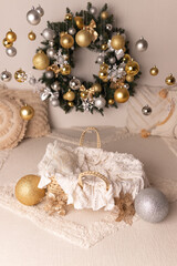 New Year's decor. Decor for the New Year. New Year's photo shoot for a newborn. Photo zone for a newborn with New Year's decor. Christmas wreath on the wall.