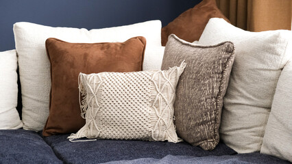 White brown pillow mockup couch with modern interior background and dark blue wall with no people....