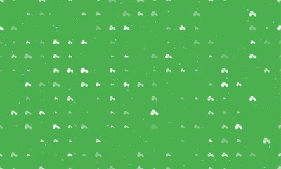 Seamless background pattern of evenly spaced white tractor symbols of different sizes and opacity. Vector illustration on green background with stars