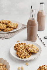 A heap of Portugues traditional peanut cookies known as Bolachas de Amendoim on the white plate