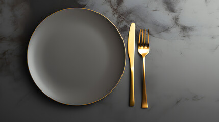Dark plate with with golden cutlery on black background - obrazy, fototapety, plakaty