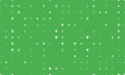 Seamless background pattern of evenly spaced white elephant heads of different sizes and opacity. Vector illustration on green background with stars