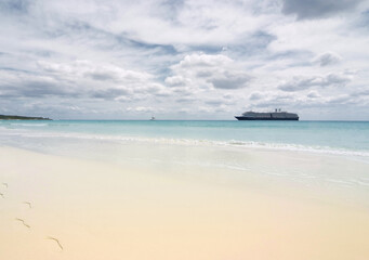 Fototapeta na wymiar Anchored Vessel on Idyllic Beach