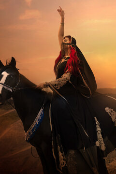 A warrior girl in a black oriental costume on a black horse with a katana in her hands.
